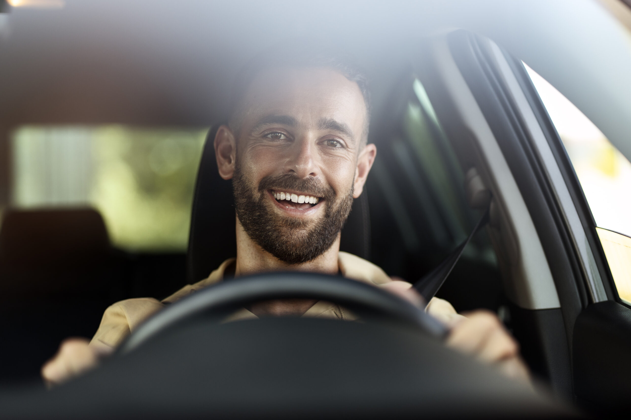 handsome smiling latin man driving a car car shar 2025 02 20 09 23 42 utc scaled