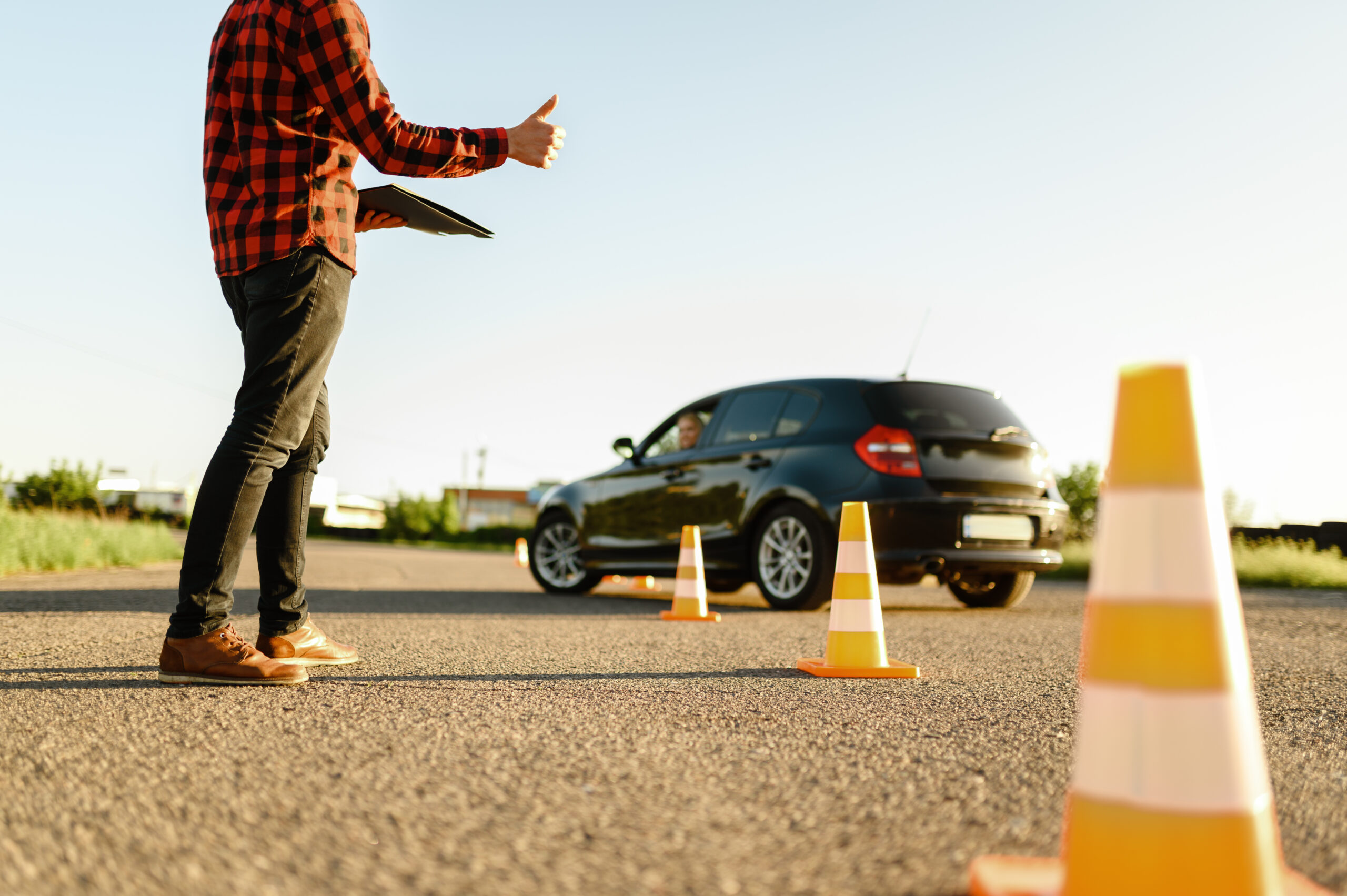 instructor helps student to drives between cones 2024 12 05 07 58 38 utc scaled