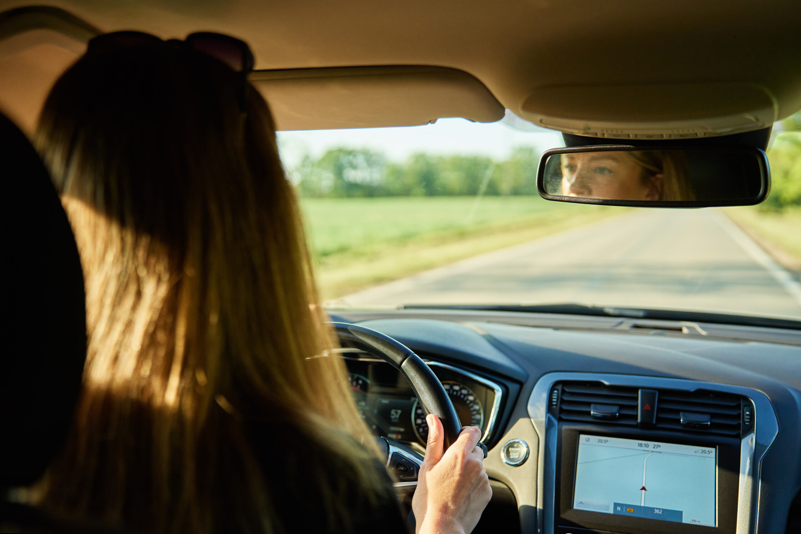 woman driving car on country road back view of fe 2025 03 16 20 31 05 utc scaled